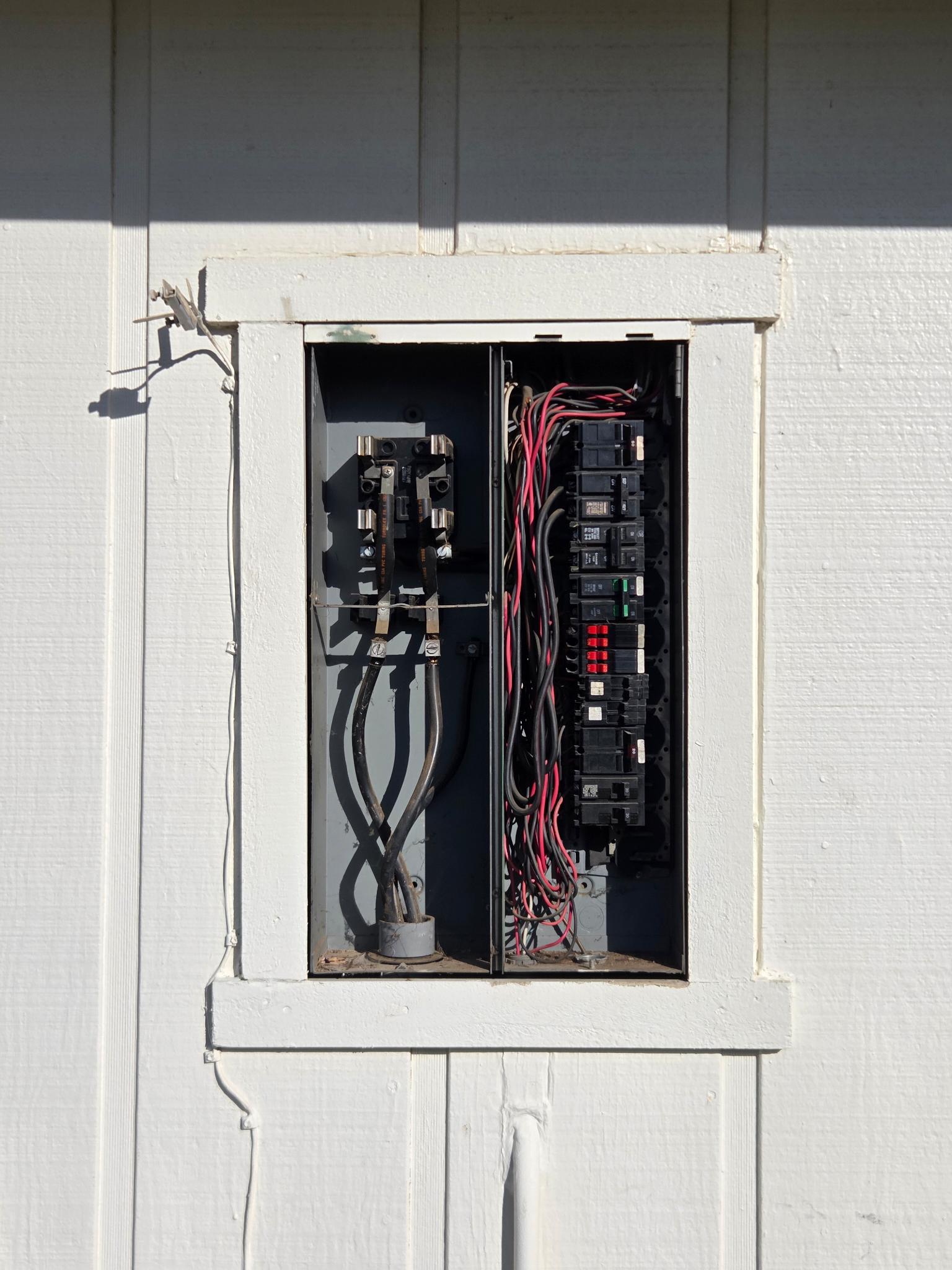 Finished exterior electrical panel installation